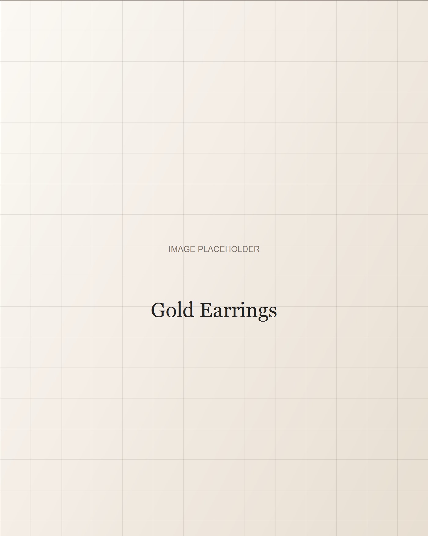 Small gold earrings on cream fabric